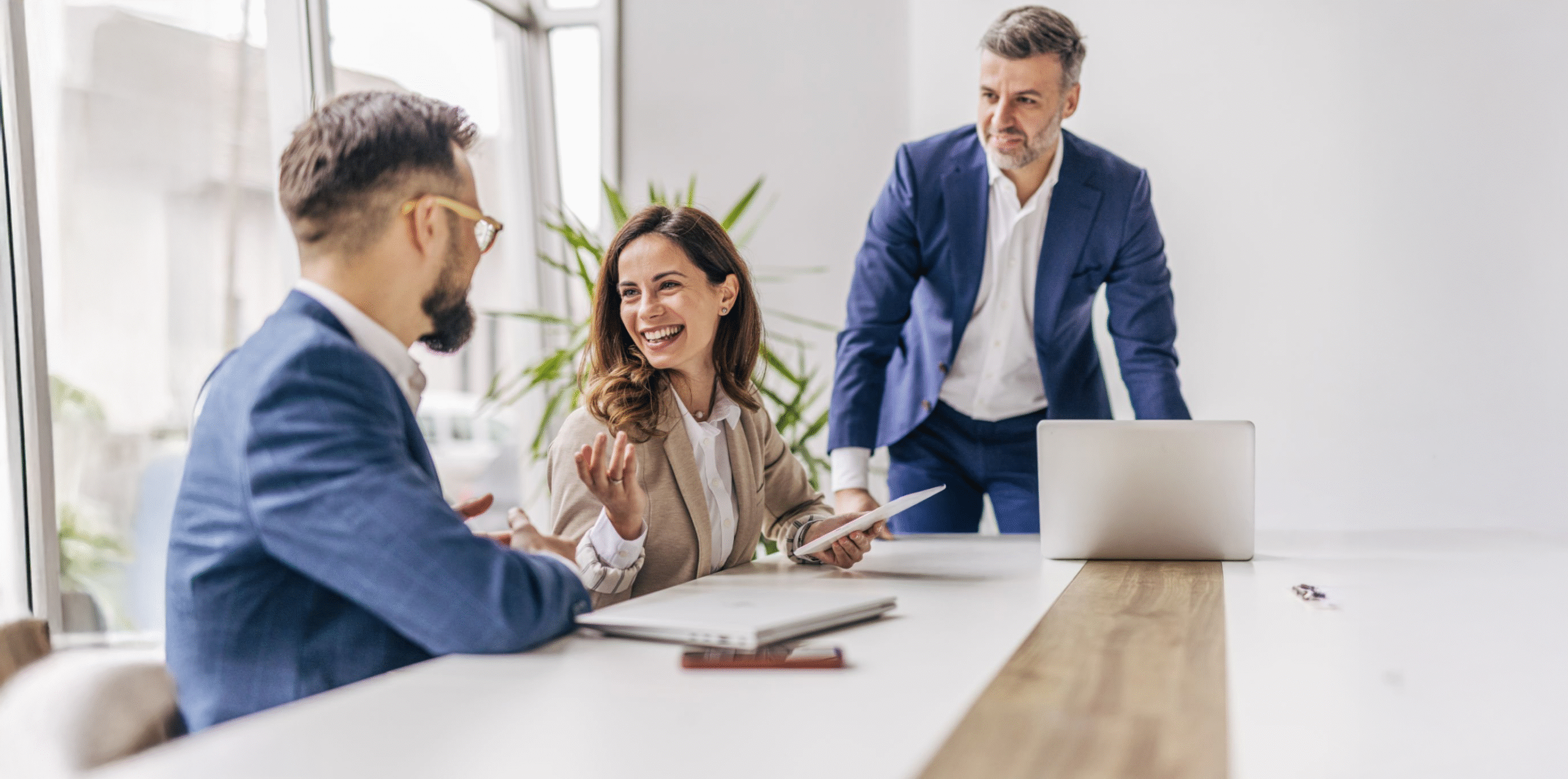 CHR teammates collaborating in a bright workspace